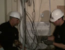 Electricians installing Hyde